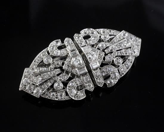A 20th century Art Deco style white gold? and diamond double clip brooch, 65mm.